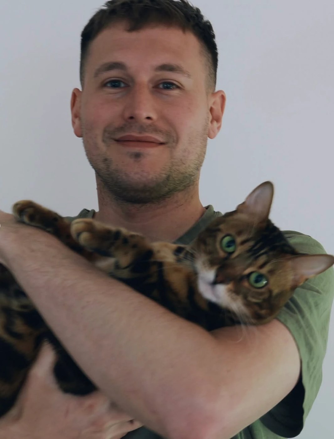 Oleh holding Sky, the Bengal cat who started Heirpaws